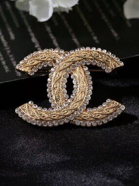chaneI  brooches